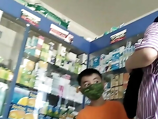 Mom with son in pharmacy. Little...